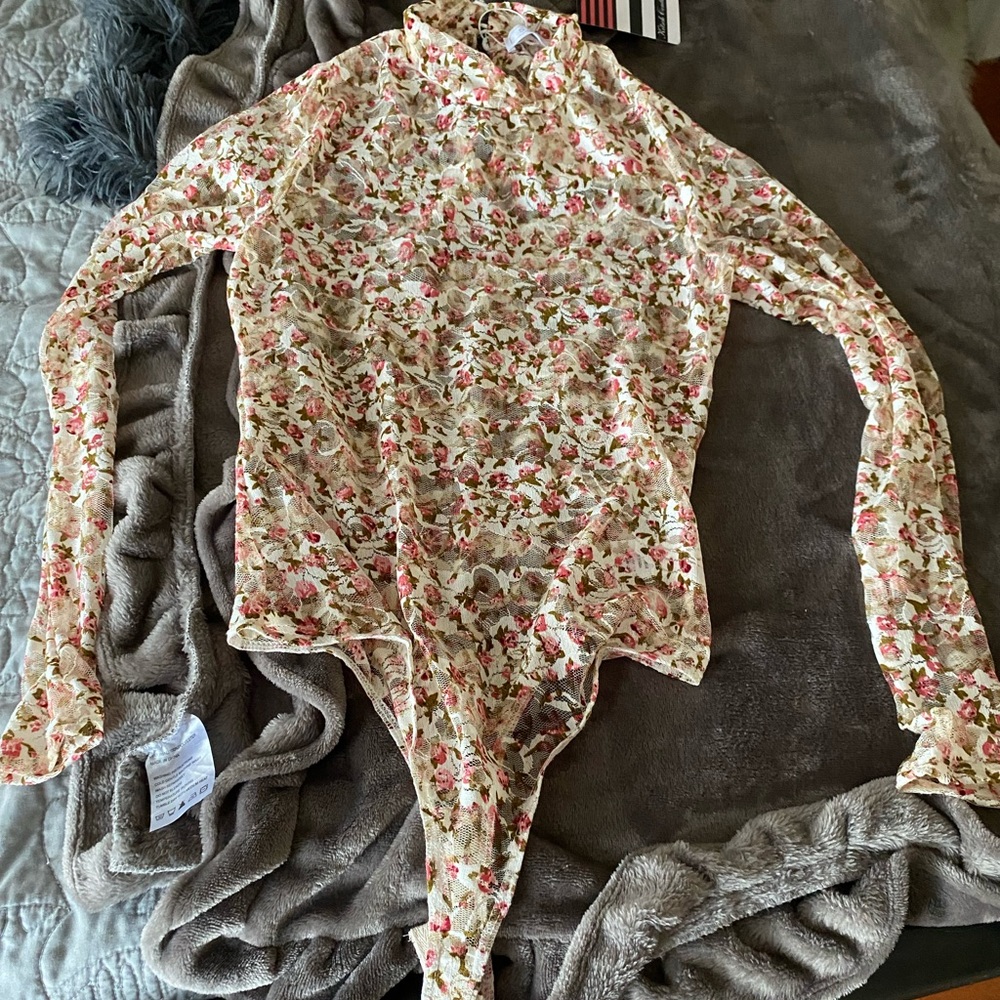 Bodysuit with sheer details. Floral print. NWT.